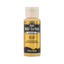 Load image into Gallery viewer, A bottle of FolkArt Multi-Surface Metallic acrylic paint in color 2955 14K Gold, featuring a gold and black label with a white cap, on a solid white background.