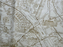 Load image into Gallery viewer, Close-up of Paris Flea Market Fabric by 3 Sisters Moda of vintage-style map designs with detailed street names and landmarks.