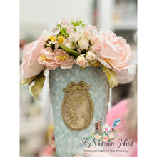 Load image into Gallery viewer, Upcycled Cottage style Vase with pink flowers decoupaged in light blue quilted background rice paper with a Cameos mould casting on front 
