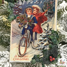 Load image into Gallery viewer, A Merry Christmas Victorian Postcard Ornament, Bike Ride, closeup