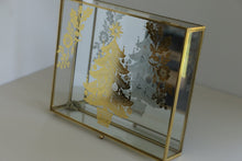 Load image into Gallery viewer, A rectangular gold-framed glass tray with etched Christmas tree and floral designs, resting on a light beige surface against a white background.