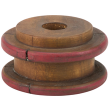 Load image into Gallery viewer, A vintage wooden spool or pulley wheel with a natural brown wood finish and red painted accents on the outer rims, shown against a plain white background.