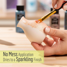 Load image into Gallery viewer, Person applying a substance to a small ceramic item with a brush, with text about no mess application and sparkling finish.