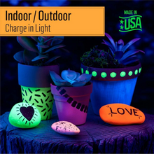 Load image into Gallery viewer, Glowing plant pots and stones on a dark background with 'Made in USA' label.