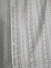 Load image into Gallery viewer, Yuwa Live Life Collection Pink Ditsy Rose Fabric Selvedge close up view