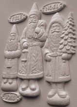Load image into Gallery viewer, Three carved Santa Claus figures in light gray stone or concrete, standing side by side on a matching gray background. The figures are labeled with seasonal words: YULE at the top left, NOEL at the top right, and JOIE at the bottom left.