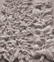 Load image into Gallery viewer, White carved floral and leaf wall panel with raised botanical relief details on a matching background.