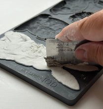 Load image into Gallery viewer, IOD Les Lapins Mould demonstrating clay pressed into mould and leveled