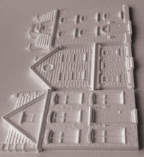 Load image into Gallery viewer, White plastic miniature building pieces for dioramas, featuring detailed house designs with windows, doors, and textured brick patterns, arranged on a light gray background.