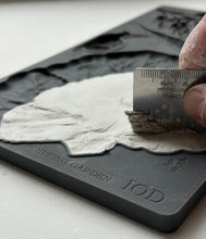 Load image into Gallery viewer, Hand using a ruler to level clay in IOD Spring Garden Mould Mold