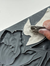 Load image into Gallery viewer, Close-up of a hand using a tool to level air dry clay in IOD Tulips Mould