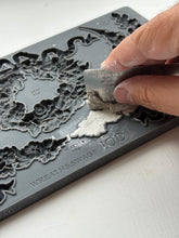 Load image into Gallery viewer, View of hand level clay with a ruler in IOD Wreath and Swags Moud