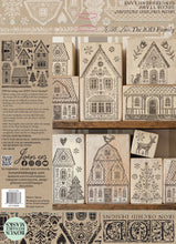 Load image into Gallery viewer, A product display sheet for 'Winter Village' iron-on stamp designs by Iron Orchid Designs, showing multiple wooden house and tree designs in different levels of detail, alongside product information text and a QR code.