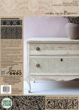 Load image into Gallery viewer, Antique painted dresser stamped with IOD Lace Decor Stamp shown on back of Iron Orchid Designs product packaging