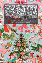 Load image into Gallery viewer, A Christmas-themed transfer paper sheet featuring a busy holiday pattern with a robin, carousel horse, ornaments, gifts, gingerbread men, bows, and a central title panel reading 'Iron Orchid Designs Transfer Darling Holiday' and 'Eight 8" x 12" sheets'.