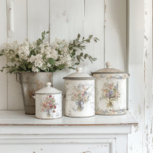 Load image into Gallery viewer, Decorative canisters with floral bouquet designs made with IOD Madeline Transfer on a wooden sideboard with rustic decor background