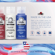 Load image into Gallery viewer, Three bottles of FolkArt acrylic paint with a Plaid Industries advertisement on a colorful background.