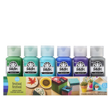 Load image into Gallery viewer, Set of FolkArt acrylic paint bottles with a display of painted projects on a white background