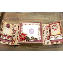 Load image into Gallery viewer, An open vintage-style paper album or scrapbook book displayed on a wooden surface, showing multiple decorated interior pages with floral and holiday-themed designs.