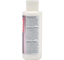 Load image into Gallery viewer, A white plastic bottle of PPG ColorTouch hair color with a white cap, showing the back label with text in black and red, on a white background.