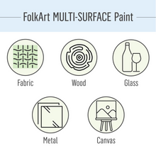 Load image into Gallery viewer, FolkArt Multi-Surface Paint compatibility icons for fabric, wood, glass, metal, and canvas on a light blue background.