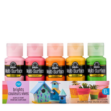 Load image into Gallery viewer, Set of FolkArt Multi-Surface Satin acrylic paint bottles in various bright colors with a sample project on a white background.