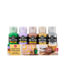 Load image into Gallery viewer, Set of Multi-Surface acrylic paint bottles in various colors with a display box on a white background.