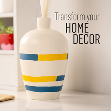 Load image into Gallery viewer, Decorative vase with blue and yellow stripes on a neutral background