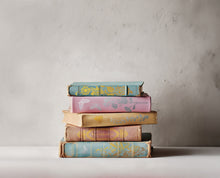 Load image into Gallery viewer, Stack of old pastel books with bindings decorated with IOD Papillon Gilded gold transfers.