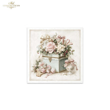 Load image into Gallery viewer, A framed decorative art print featuring a pastel bouquet of pink and white roses in a vintage box, with ribbons, small ornaments, and a teacup on a cream background. The print is shown centered on a white background with a small 'Ash Collection' logo in the top-left corner.
