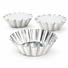 Load image into Gallery viewer, Three scalloped fluted metal tart pans in silver aluminum, with one pan in the foreground and two in the background on a white studio background.