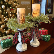 Load image into Gallery viewer, Decorative candle holders with Christmas-themed candles in a festive setting.