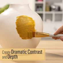 Load image into Gallery viewer, Person painting a white vase with gold paint using a brush, with text overlay 'Create Dramatic Contrast and Depth'.