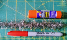 Load image into Gallery viewer, Visual size reference of width of Tinsel Garland next to a Sharpie Pen and an Elmers Glue Stick 